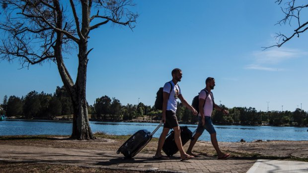 Polish tourists Tom and Andrew walking from Wolli Creek station to Sydney Airport.