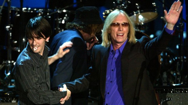 Tom Petty and Dhani Harrison, the son of the late George Harrison, perform at the Rock and Roll Hall of Fame Induction Ceremony in 2004.