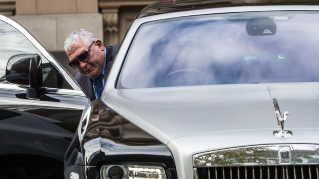 Mick Gatto leaves court in a Rolls Royce.