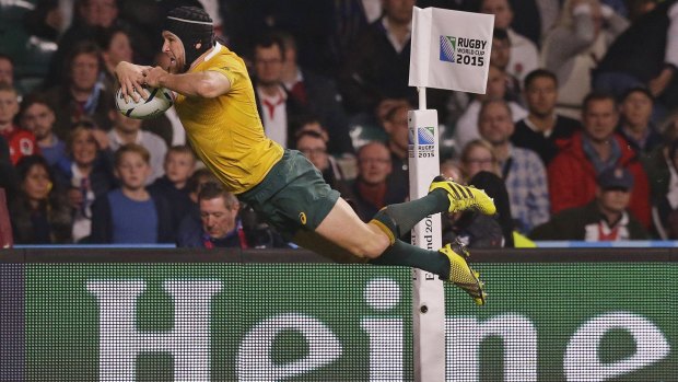 Australia's Matt Giteau scores his side's third try during the Rugby World Cup Pool A match between England and Australia.