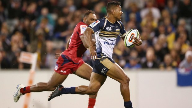 ACT Brumbies fullback Aidan Toua in full flight against the Reds at Canberra Stadium on Saturday night.