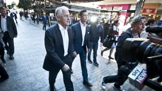 Prime Minister Malcolm Turnbull tours the Queen Street Mall with Member-elect for Brisbane Trevor Evans.