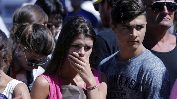 A woman visiting the scene of Thursday's carnage.