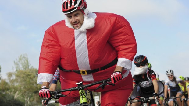 Santa (Andrew Blair) traded  his sleigh for a bike, and joined the pack on Adelaide Avenue.
