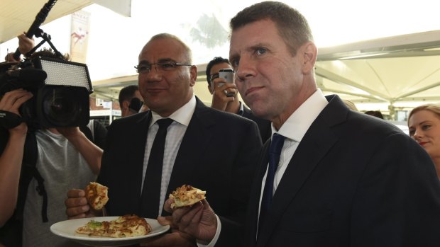 Former premier Mike Baird on the 2015 campaign trail in Auburn with the party's candidate Ronney Oueik, a former Auburn councillor.