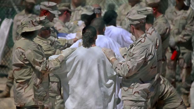 Guards and detainees in Guantanamo's Camp 4 detention facility in 2009.