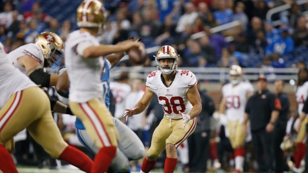 Backed: Jarryd Hayne looks for a pass from quarterback Blaine Gabbert against the Lions.