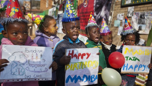 Children sing <i>Happy Birthday To You</i> to Nelson Mandela in 2013.
