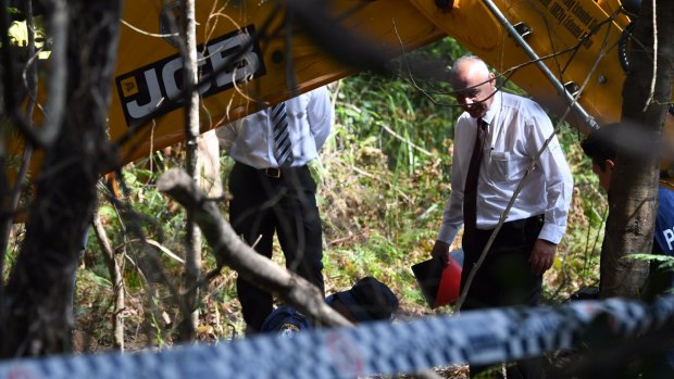 Detectives at the search site in the Royal National Park on Friday.