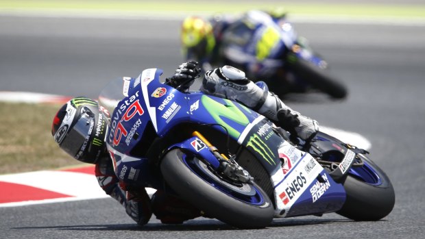 Jorge Lorenzo is followed by Valentino Rossi during the race.