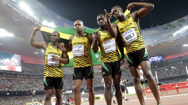 From left: Jamaica's Nesta Carter, Asafa Powell, Nickel Ashmeade and Usain Bolt celebrate after winning the 4x100 metres relay.