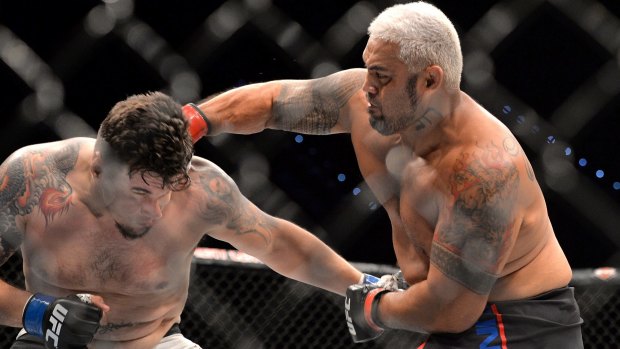 Big boppers: Mark Hunt delivers the knockout punch against Frank Mir during their UFC Heavyweight Bout in Brisbane last weekend.