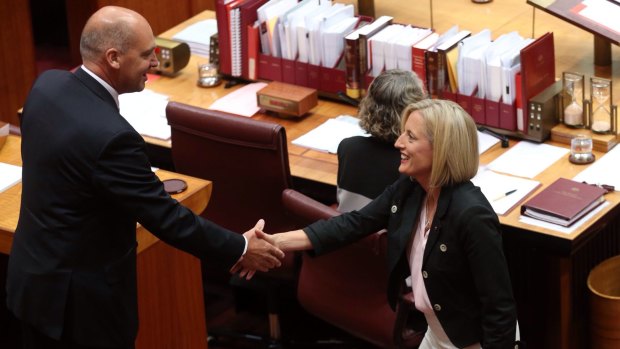 Katy Gallagher is congratulated by Senate president Senator Stephen Parry at Parliament House in Canberra on Thursday.