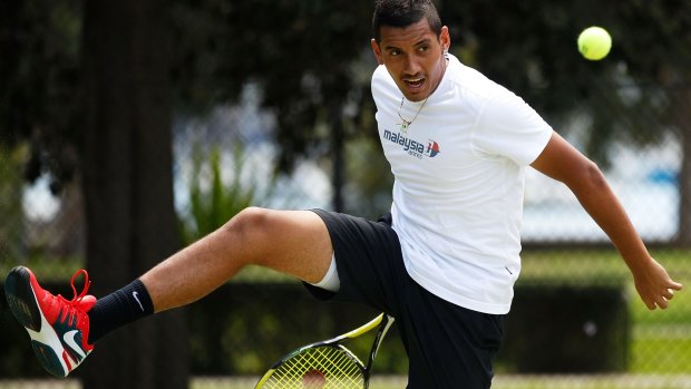 Nick Kyrgios hits some balls   during the announcement of his partnership with Malaysian Airlines.