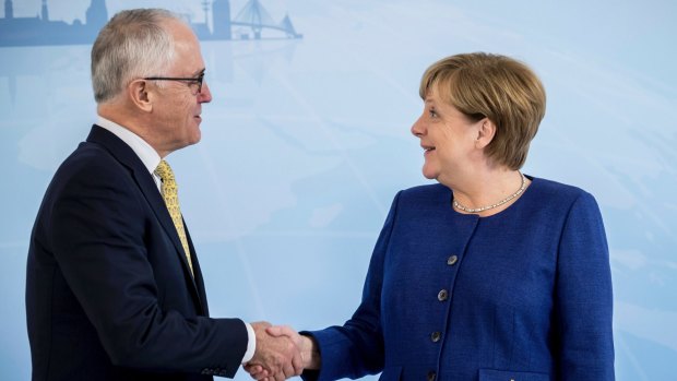 German Chancellor and host of this weekend's G20 meeting Angela Merkel greets Prime Minister Malcolm Turnbull.