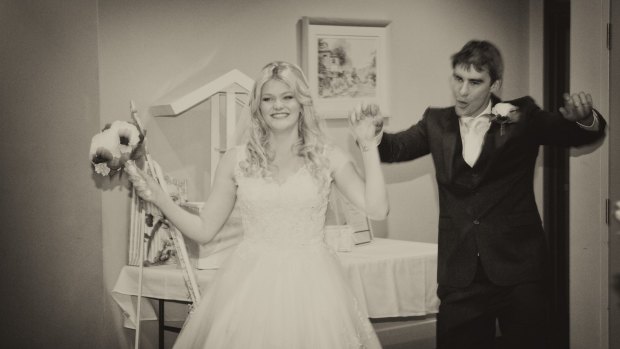 Melanie and Mitchell Buscombe's only reception arrival frame was delivered sepia-toned and blurred.