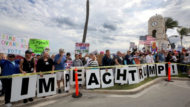 Protester gather and march in protest of Donald Trump in West Palm Beach, Flordia.