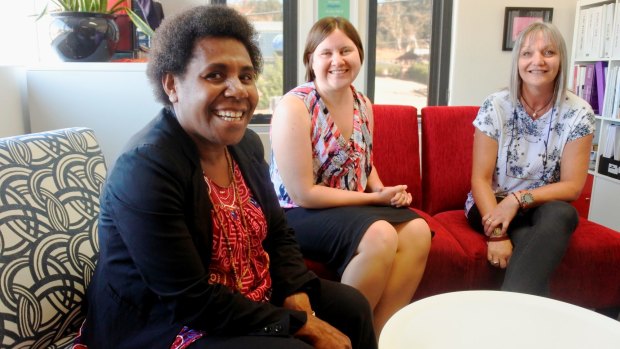 Femili?PNG casework manager Evan Biseo with Lindy Kanan and Domestic Violence Crisis Service director of crisis and legal Dearne Weaver.