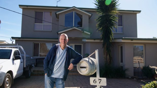Grant Taylor out the front of his Greystanes home.
