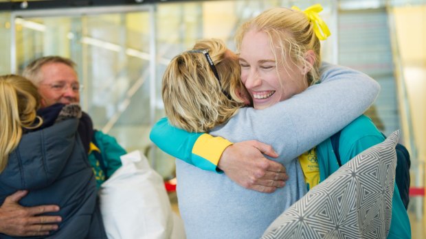 There were tears, hugs and smiles as Canberra athletes, including Kim Brennan, arrived in the capital on Wednesday.