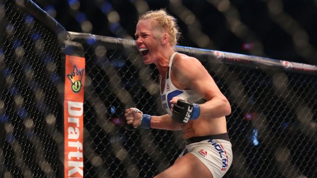Holly Holm celebrates her upset victory.