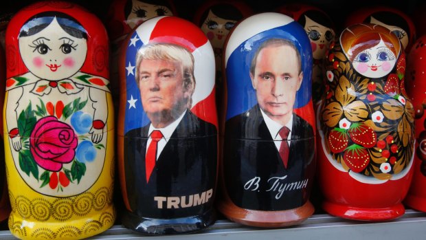 Traditional Russian wooden dolls depicting US President Donald Trump and Russian President Vladimir Putin.
