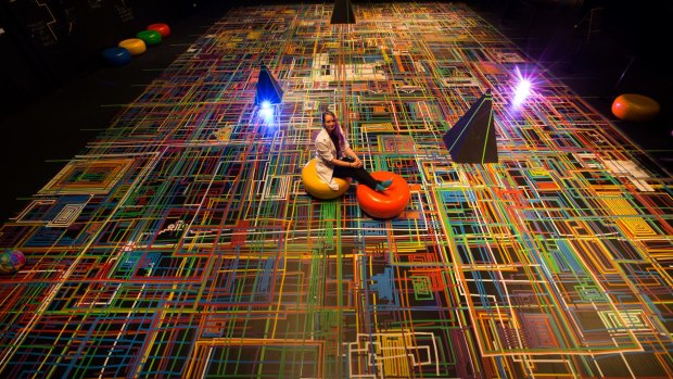 Artist Briony Barr is creating a science-based artwork along with visitors to Scienceworks using squillions of rolls of coloured sticky electrical tape. 