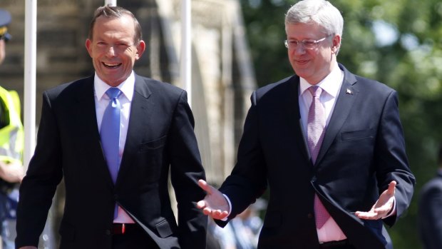Tony Abbott and Canadian Prime Minister Stephen Harper in Ottawa in June last year.