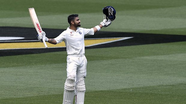 Virat Kohli acknowledges the crowd after reaching his century.