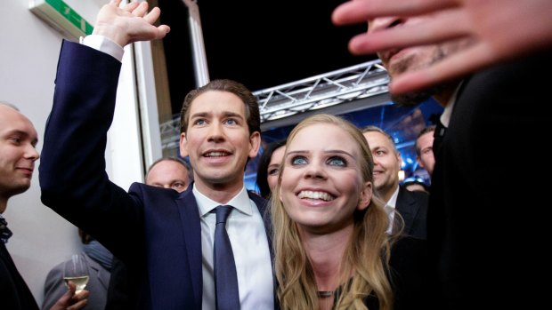 Sebastian Kurz, leader of the People's Party (OeVP), and his girlfriend Susanne Thier celebrate victory in Vienna on Sunday.