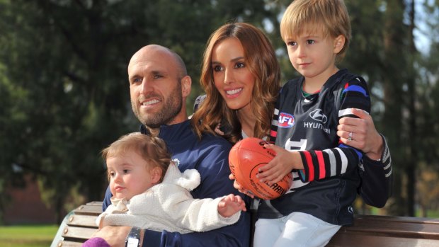 Chris Judd, after announcing his retirement, with wife Rebecca, son Oscar and daughter Billie.