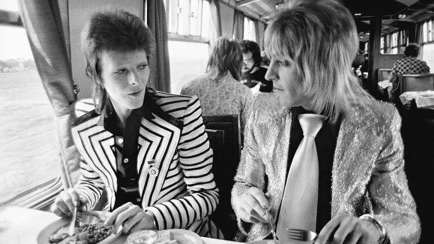 May 14, 1973, Bowie with his intrepid guitarist Mick Ronson (aka Ronno) having a British Rail lunch on the train to Aberdeen at the beginning of his final Ziggy Stardust tour.