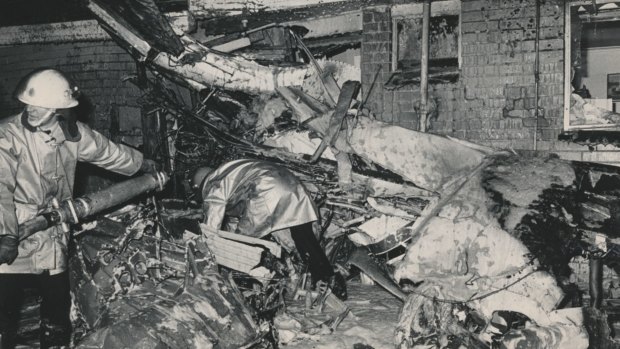 The plane wreckage wedged against the home of Giuseppe and Angela Corrso. Mrs Corrso suffered slight burns while their two children escaped injury. 