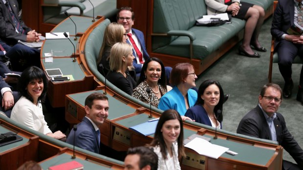 Say cheese: incoming MPs smile for the cameras on induction day.