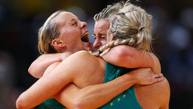 Renae Hallinan, Laura Geitz and Julie Corletto of the Diamonds celebrate victory in the 2015 Netball World Cup Gold Medal match.