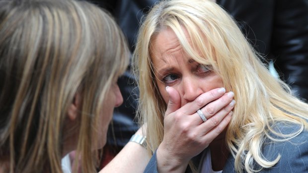 A member of the public reacts after the Arndale shopping centre was evacuated on Tuesday.