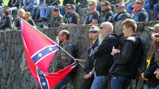 A Confederate flag, a symbol used by the Rebels outlaw motorcycle club, was flown at the rally.