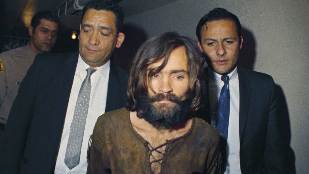In this 1969 file photo, Charles Manson is escorted to his arraignment on conspiracy-murder charges in connection with the Sharon Tate murder case.