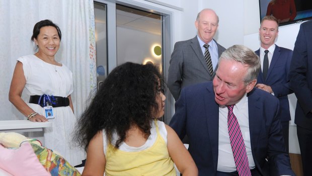 Premier Coiln Barnett talking to four-year-old Rosharnia Ah Hong at the announcement of the $140 million upgrade of Joondalup Health Campus.