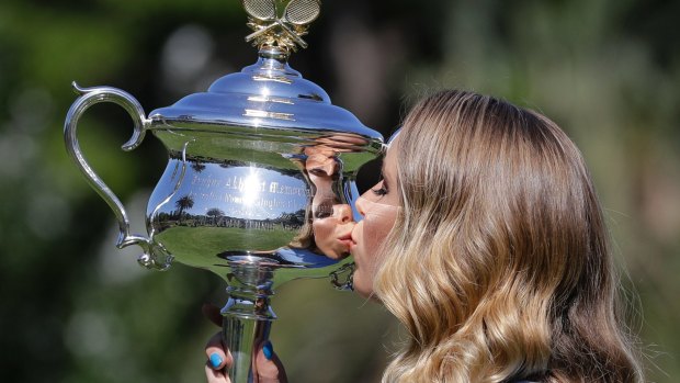 Wozniacki kisses  the Daphne Akhurst Memorial Cup.