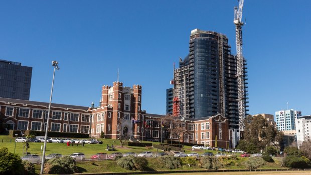 Melbourne High School (foreground) and the development at 661 Chapel Street, South Yarra, behind it.