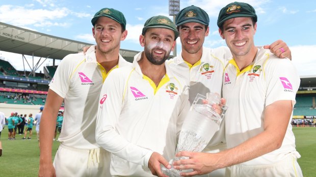 Too good: Australia's attack Josh Hazlewood, Nathan Lyon, Mitchell Starc and Pat Cummins pose with the Ashes trophy.