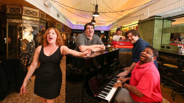 Marie's Crisis hosts (from left), Jennifer Pace, Marc Castelli, Adam Tillford and Kenney Green, "the world's only sing-a-long, show tune acoustic piano bar".