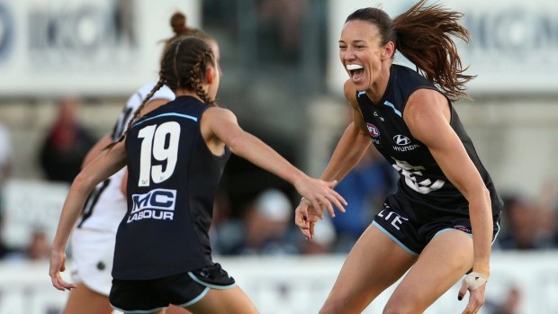 Alison Downie (right) celebrates her goal for Carlton.
