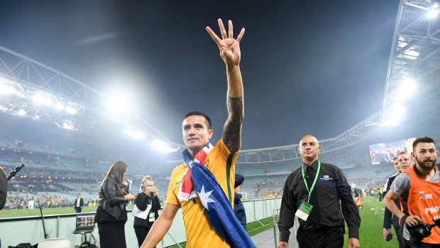Superstar Tim Cahill waves to fans after the match.
