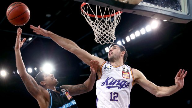 Todd Blanchfield of the Kings attempts to block a shot from Edgar Sosa of the Breakers.