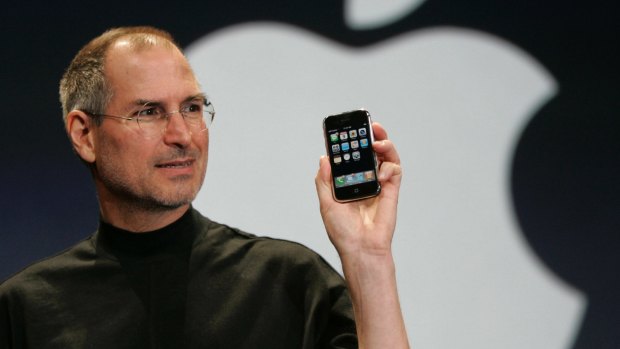 Former Apple CEO Steve Jobs with the original iPhone in 2007.
