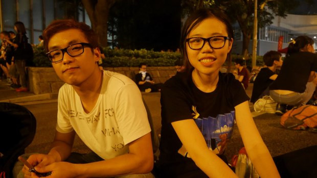 Student protesters Sam Tsang, 19, and Nicole Lau, 20.