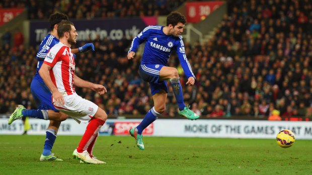 Reaching his goal: Cesc Fabregas of Chelsea scores their second goal during the Premier League match between Stoke City and Chelsea at Britannia Stadium.