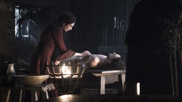 Melisandre (Carice van Houten) resurrects Jon Snow (Kit Harrington) in <i>Game of Thrones</i> season 6 episode 2.